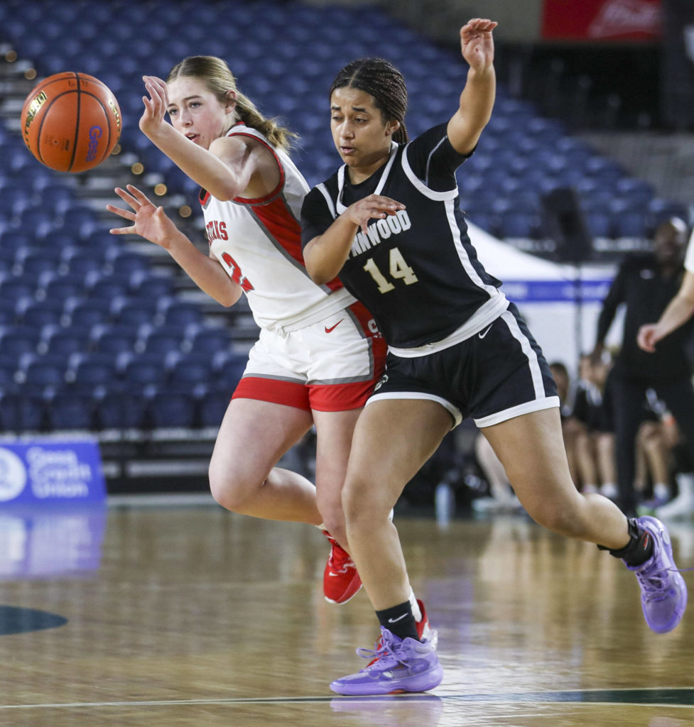 Stanwood’s Ellalee Wortham (2) and Lynnwood’s Dina Yonas (14) fight for the ball during a 3A girls game in the Hardwood Classic between Lynnwood and Stanwood at the Tacoma Dome in Tacoma, Washington on Wednesday, March 1, 2023. Stanwood won, 74-69. (Annie Barker / The Herald)
