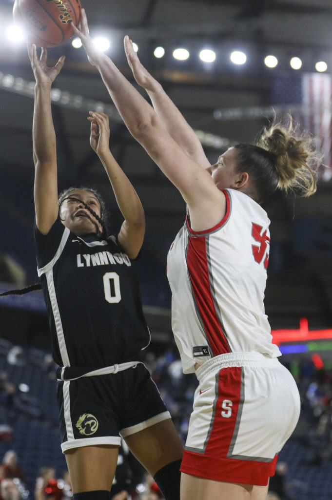 Lynwood’s Aniya Hooker (0) shoots the ball during a 3A girls game in the Hardwood Classic between Lynnwood and Stanwood at the Tacoma Dome in Tacoma, Washington on Wednesday, March 1, 2023. Stanwood won, 74-69. (Annie Barker / The Herald)
