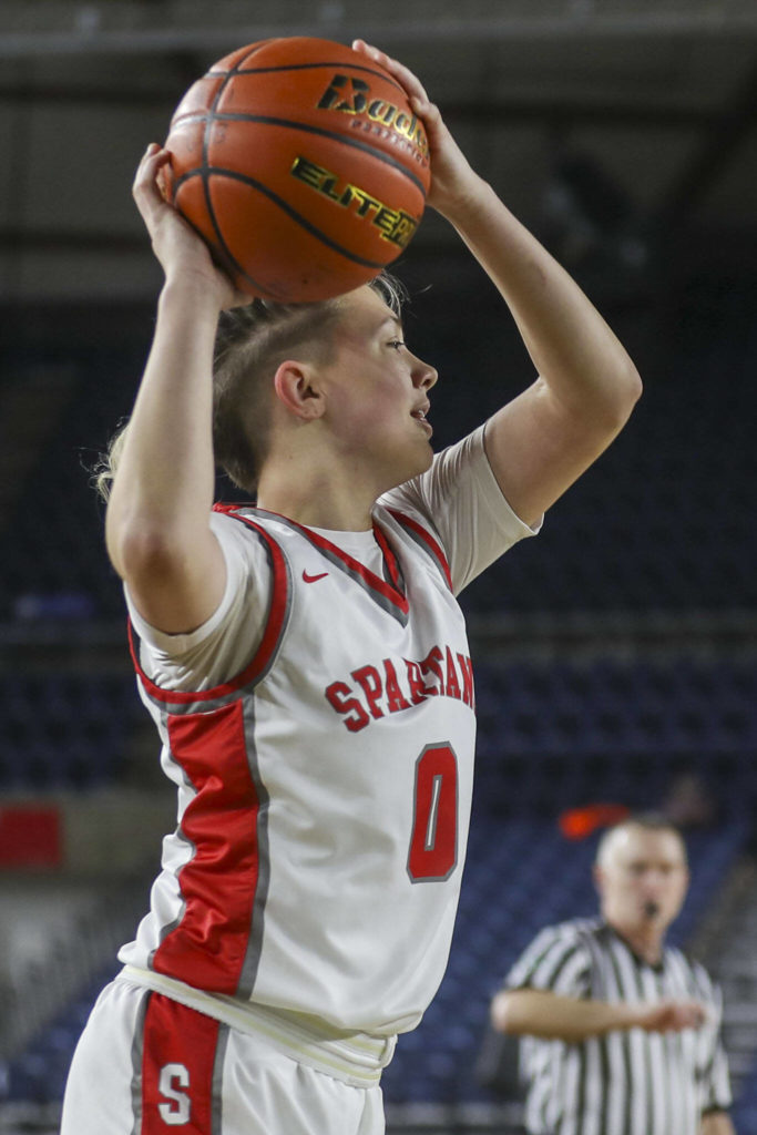 Stanwood’s Grace Walker (0) shoots for a three during a 3A girls game in the Hardwood Classic between Lynnwood and Stanwood at the Tacoma Dome in Tacoma, Washington on Wednesday, March 1, 2023. Stanwood won, 74-69. (Annie Barker / The Herald)
