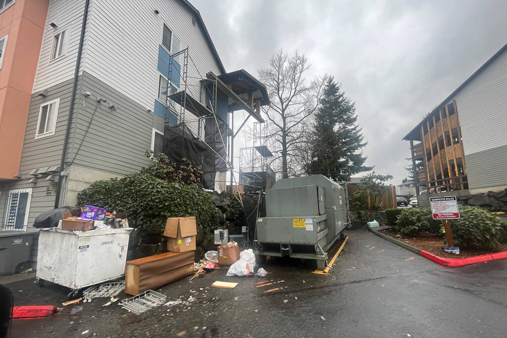 Garbage seen outside at the Rivers Landing apartment complex in Everett, Washington. Trash on the property is removed by a vendor three times a week, according to management. (Photo provided by Austin Webb)
