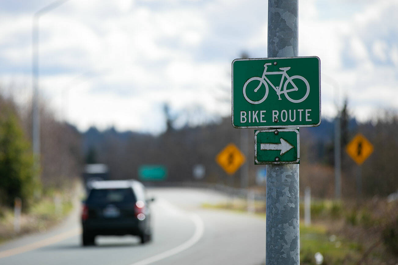 A sign diverts bicyclists to a short path that leads to the shoulder of U.S. 2 headed east near the junction with Highway 204 on Monday, March 6, 2023, in Lake Stevens, Washington. (Ryan Berry / The Herald)
