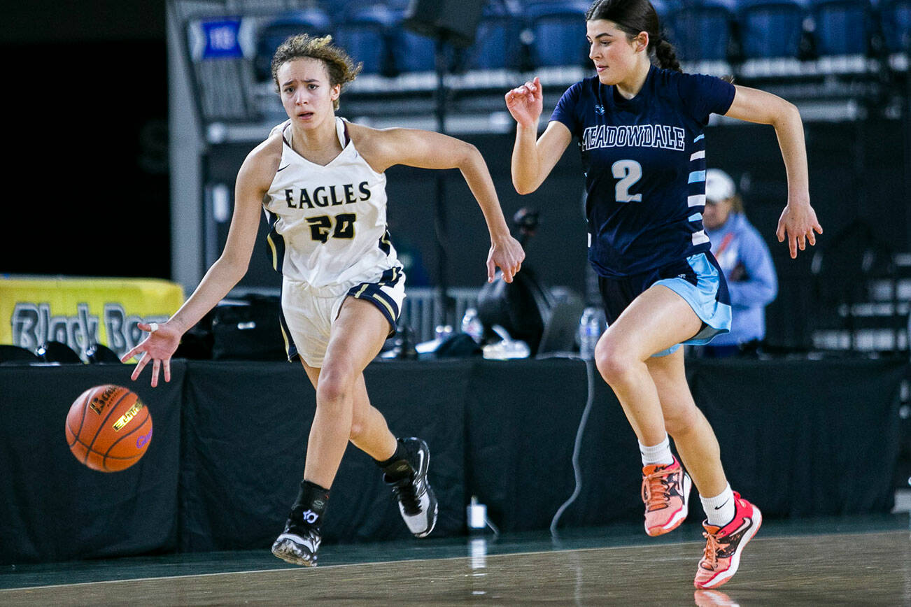 Arlington’s Samara Morrow takes the ball down the court during the 3A quarterfinal game against Meadowdale on Thursday, March 2, 2023 in Tacoma, Washington. (Olivia Vanni / The Herald)