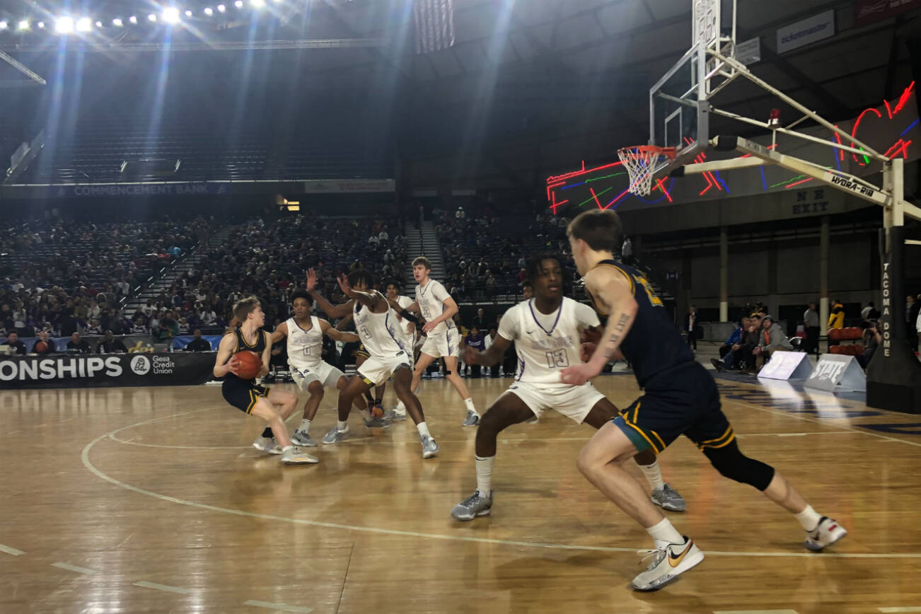 Shorecrest (blue jerseys) takes on Garfield in a boys 3A state quarterfinal game on Thursday, March 2, 2023, at the Tacoma Dome. (Evan Wiederspohn / The Herald)