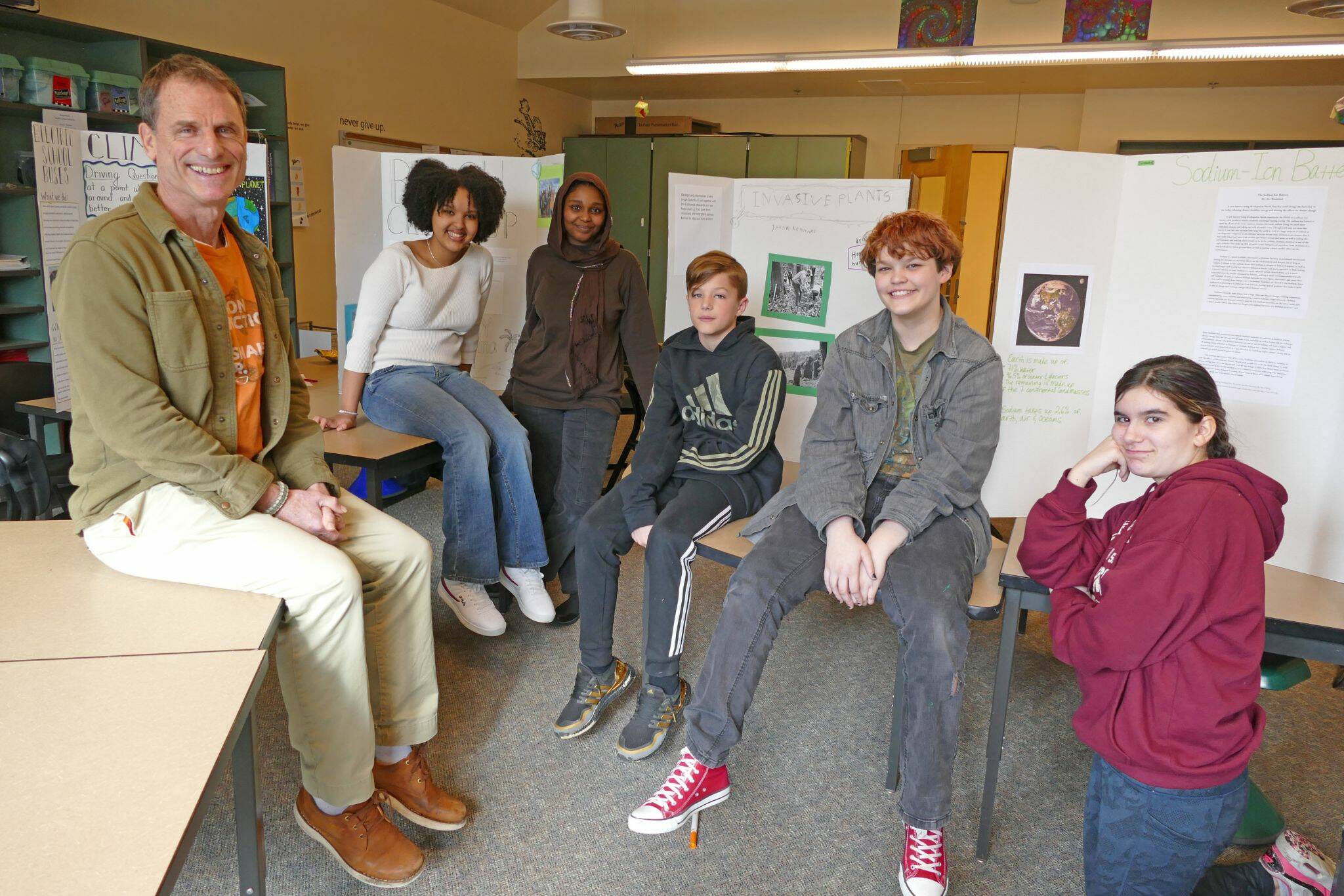 Bradley Barton with graduates of his Climate Crisis Solutions class at Maplewood Parent Cooperative school on Feb. 22 in Edmonds. From left, the students are Maedot Yoseph, Talea Mustefa, Jaxon Kennard, M.J. Pankow and Ava Woodsum. (Julie Titone)