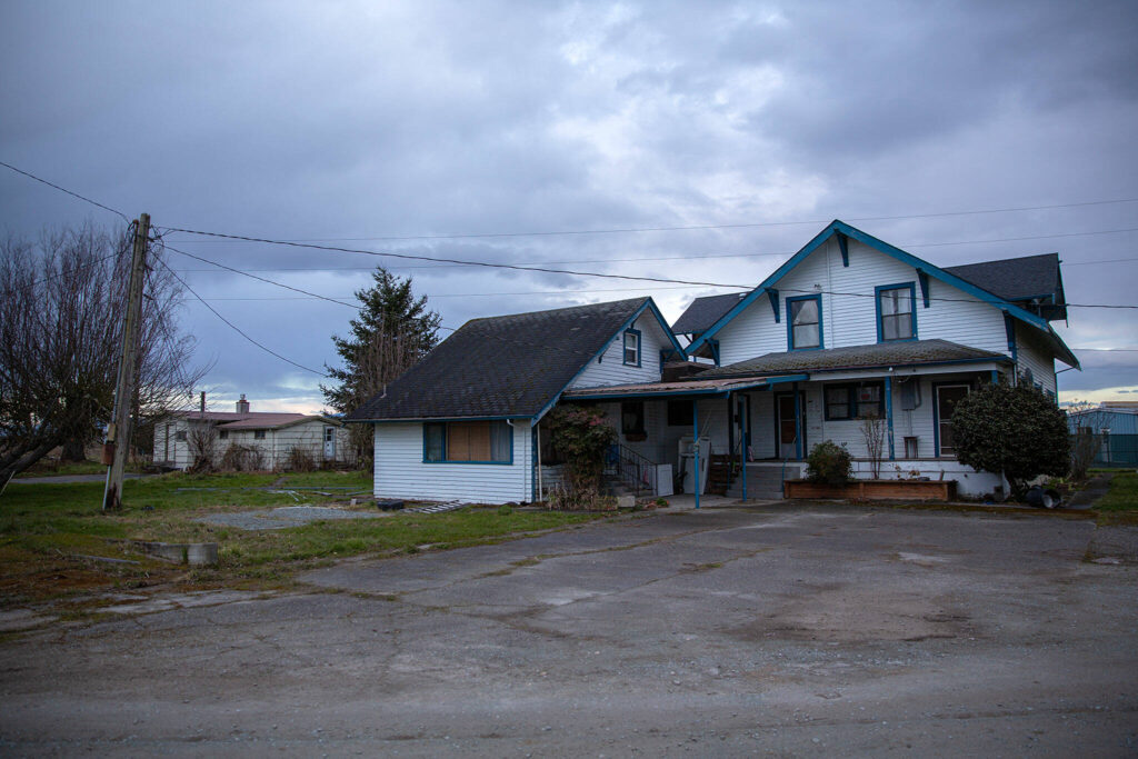 An old farmhouse at Johnson Farm is seen on Tuesday, March 7, 2023, on the west end of Stanwood, Washington. The farm buildings will be razed, and a portion of the farmland will be flooded to provide habitat for fish and other wildlife. (Ryan Berry / The Herald)
