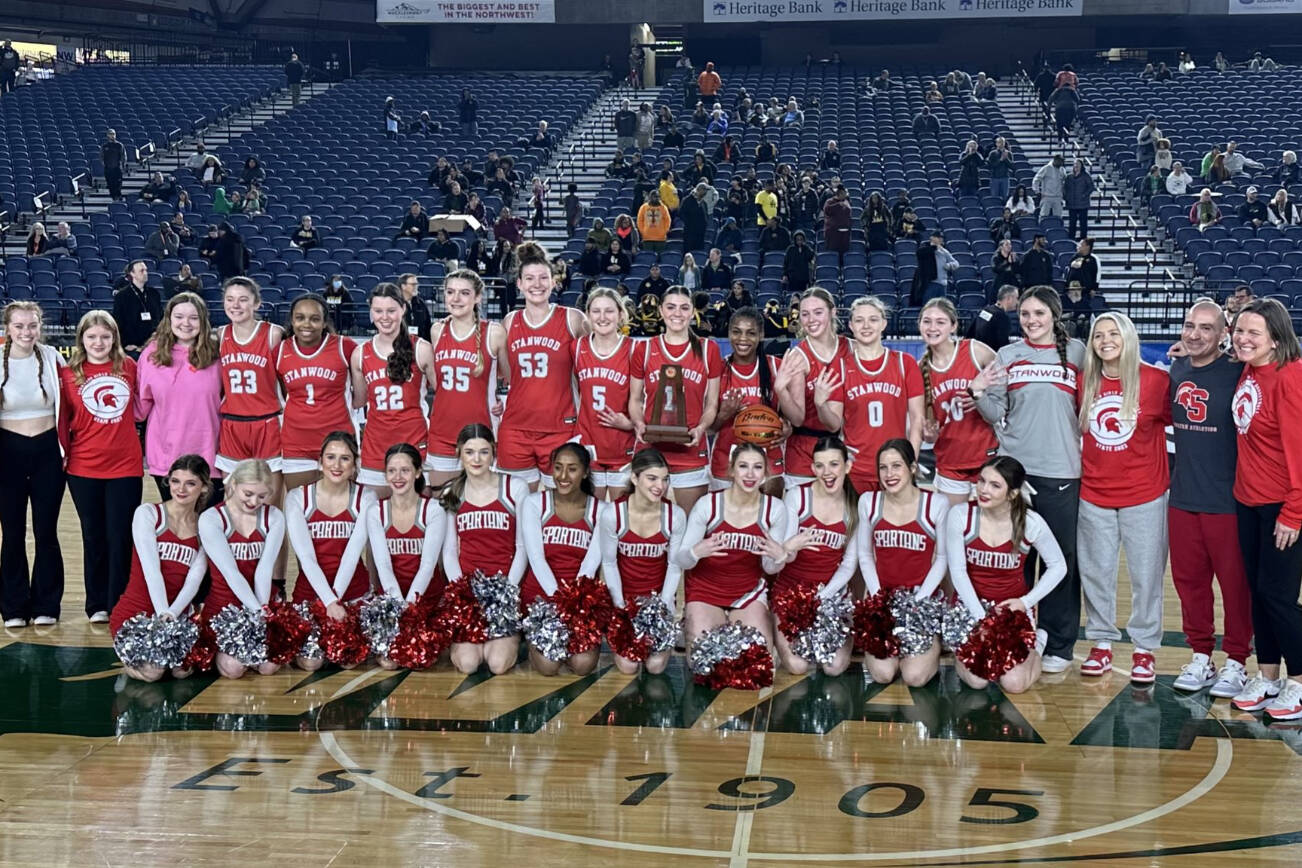The Stanwood High School girls basketball team poses with their fourth-place trophy after beating Lincoln (Tacoma), 52-45, in the Class 3A Hardwood Classic on Saturday, March 4, 2023, at the Tacoma Dome in Tacoma, Washington. (Photo courtesy of Stanwood High School)