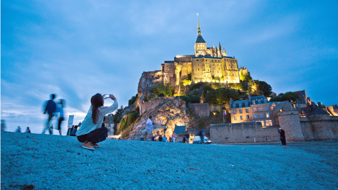 Christian pilgrims and tourists are drawn to the dramatically situated Mont St-Michel, a soaring island abbey in Normandy that is completely surrounded by the sea at high tide.