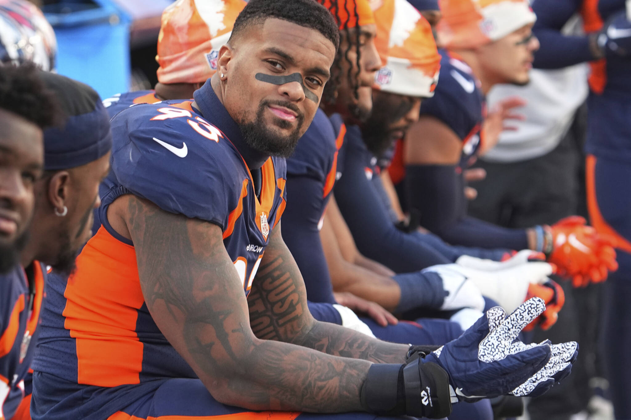 Broncos defensive lineman Dre’Mont Jones rests on the bench during a game against the Chiefs on December 11, 2022, in Denver. (AP Photo/Bart Young)
