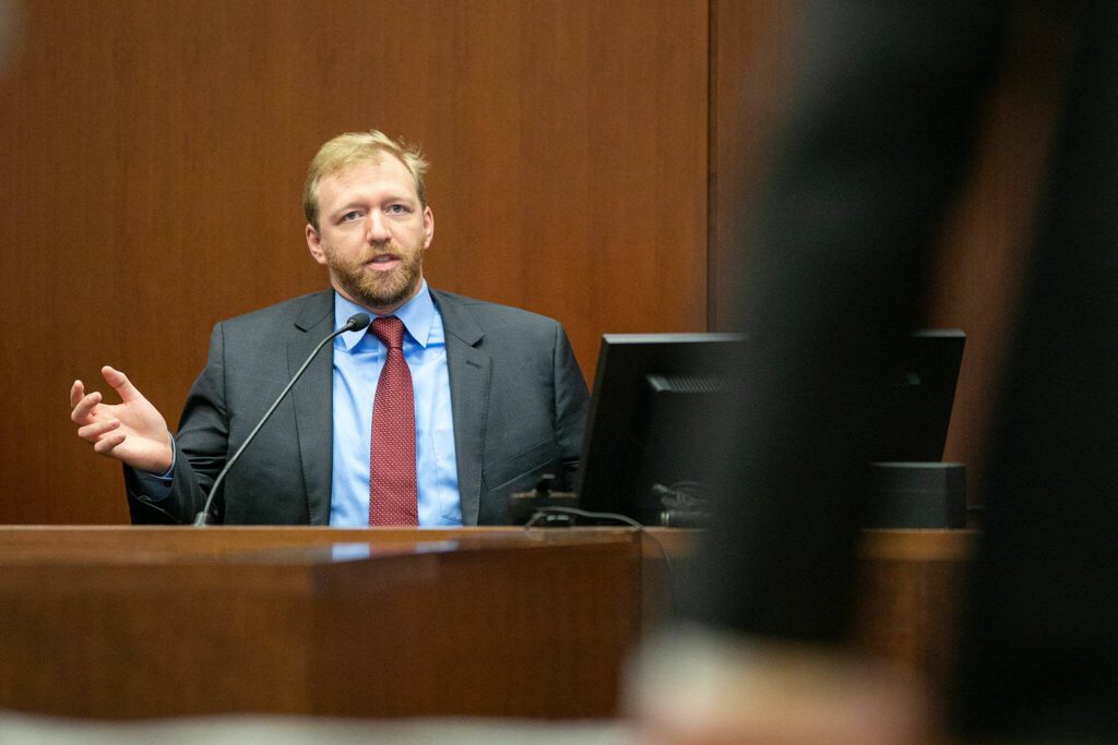 Dr. Granville Storey answers toxicological questions pertaining to methamphetamine and fentanyl during the trial of Richard Rotter on Thursday, March 30, 2023, at Snohomish County Superior Court in Everett, Washington. (Ryan Berry / The Herald)
