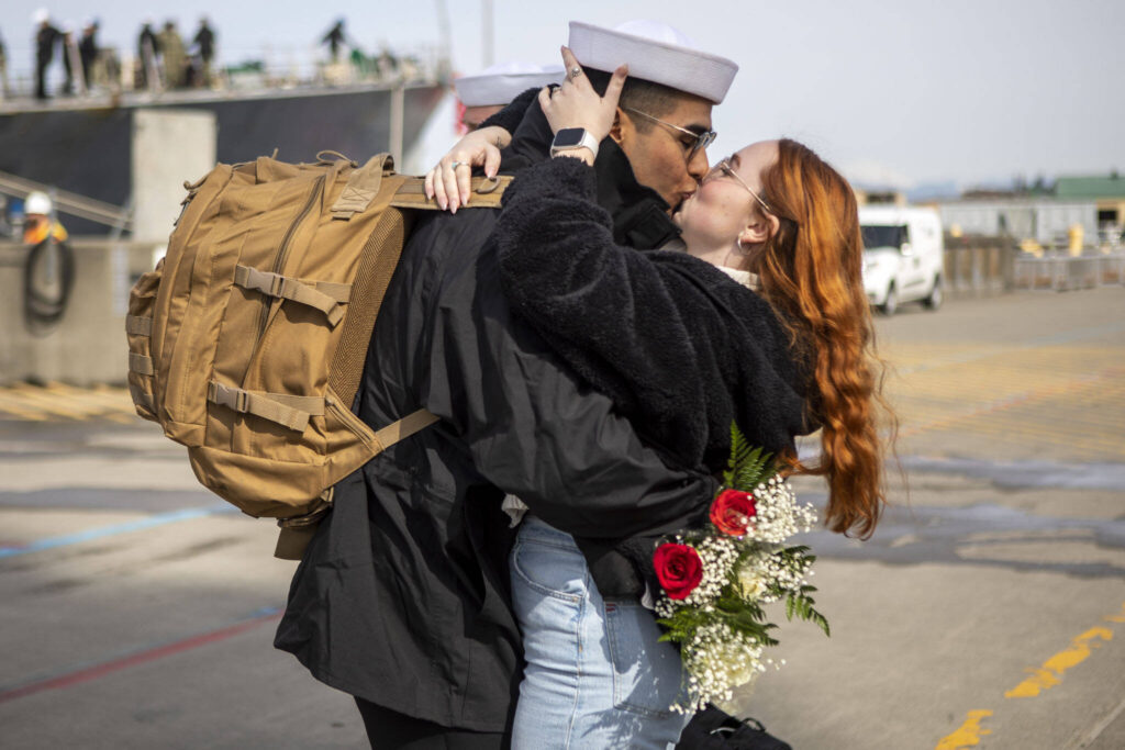 Loved ones reunite in Everett, Washington on Friday, March 17, 2023. The USS Barry arrived to its new homeport at Everett Naval Station, previously from Yokosuka, Japan. The crew is led by Commanding Officer, Cmdr. Grant Bryan. (Annie Barker / The Herald)
