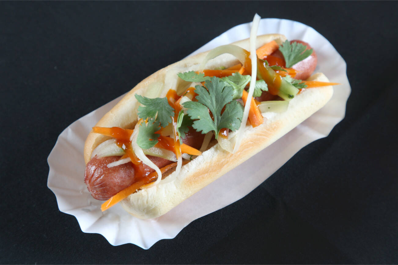 The Asian-influenced Banh Mi Dog boasts a zesty marinaded mix of crunchy daikon radishes, carrots, cucumbers, green onions, jalapeños and cilantro, drizzled with sriracha. (Quil Ceda Creek Casino)