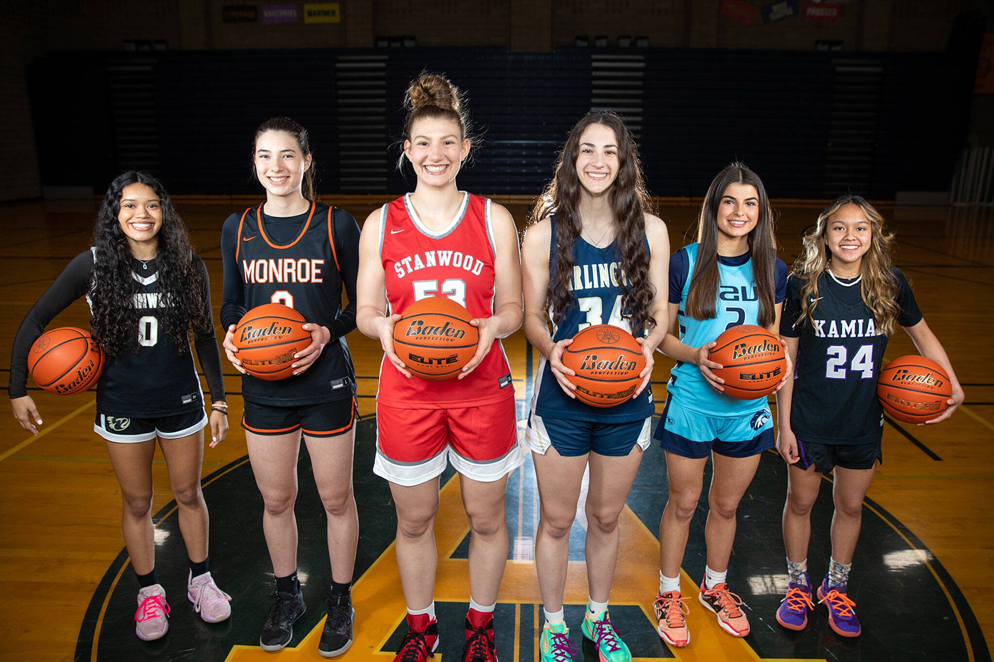 (Pictured from left) Aniya Hooker of Lynnwood, Adria Lincoln of Monroe, Vivienne Berrett of Stanwood, Jenna Villa of Arlington, Gia Powell of Meadowdale and Bella Hasan of Kamiak are The Herald’s 2022-23 All-Area girls basketball first-team members. Photographed on Sunday, March 26, 2023, at Arlington High School. (Ryan Berry / The Herald)