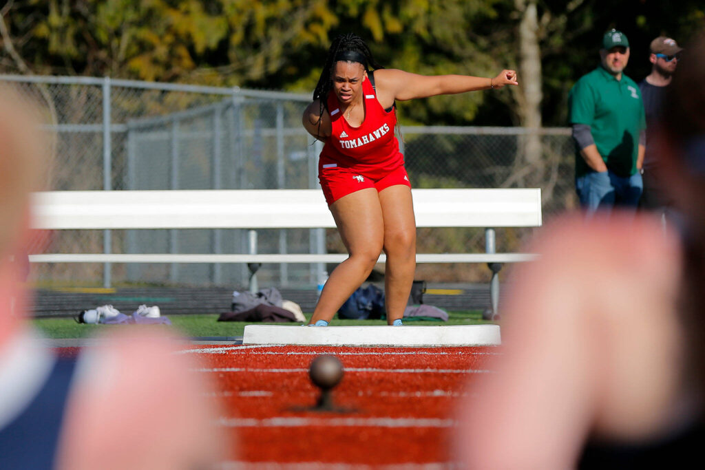 Marysville Pilchuck’s Gianna Frank watches as her shot lands with a thud during the Chuck Randall Invite at Arlington High School on Saturday, March 18, 2023, in Arlington, Washington. (Ryan Berry / The Herald)
