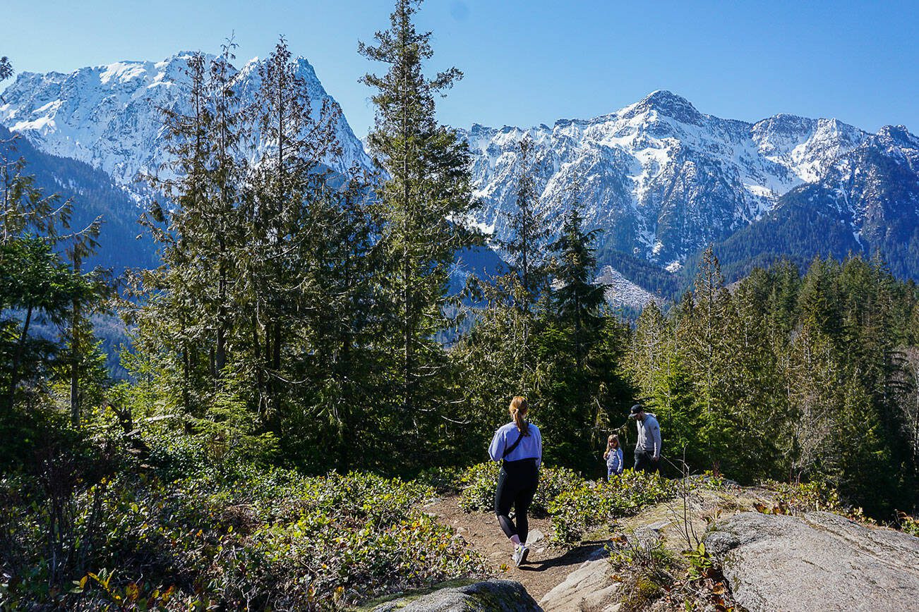 Hikers make their way along the Heybrook Ridge Trail on Friday, March 18, 2023, in Index, Washington. (Kayla Dunn / The Herald).