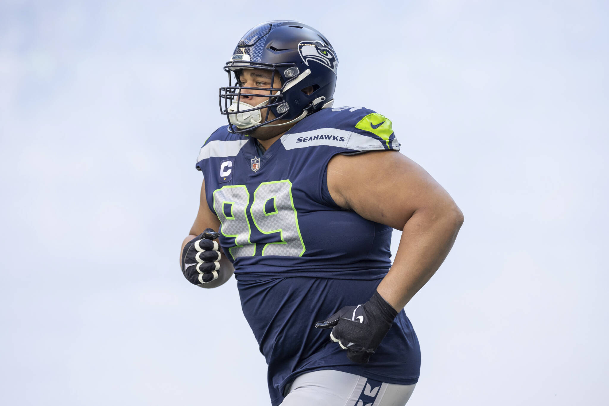 Seahawks defensive tackle Al Woods enters the field during player introductions before a game against the Jets on Jan. 1 in Seattle. (AP Photo/Jeff Lewis)