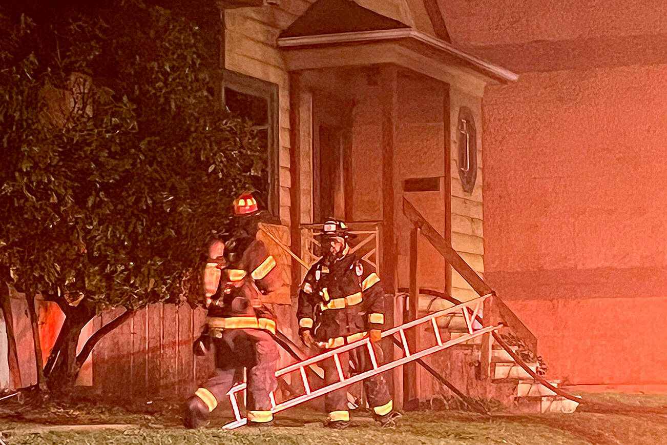 Firefighters respond to a house fire Wednesday morning in the 3400 block of Broadway. (Everett Fire Department)