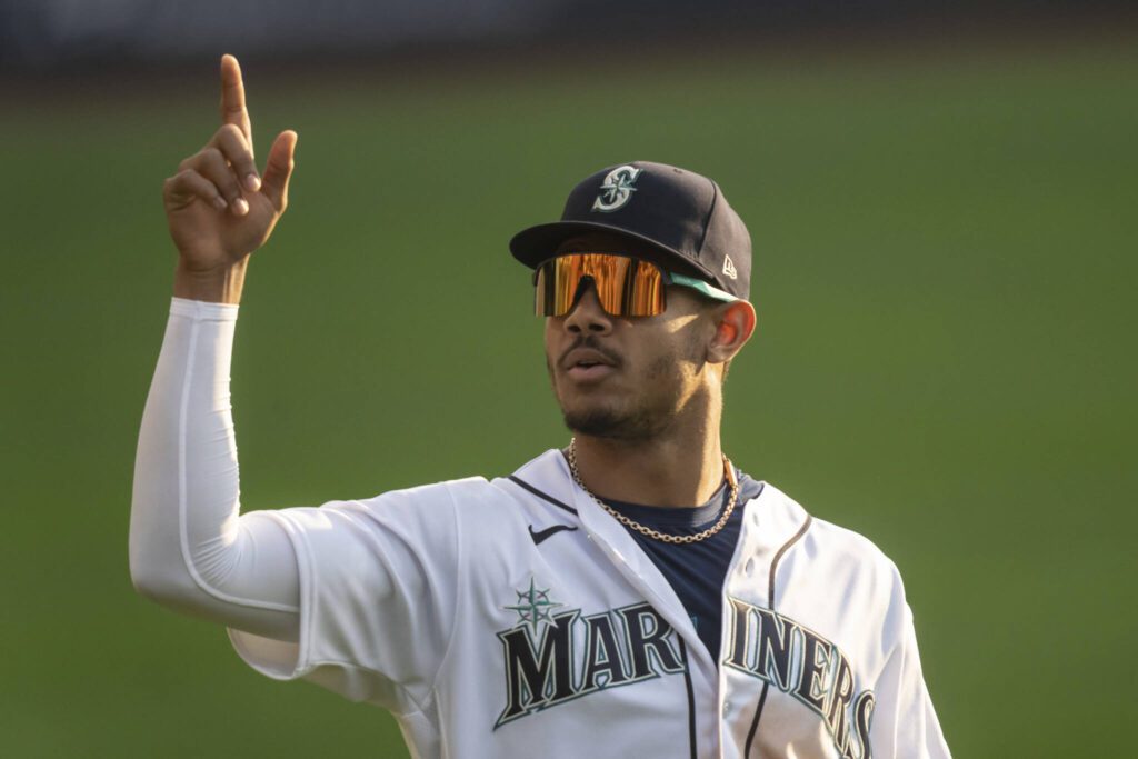 Mariners center fielder Julio Rodriguez points to fans during Game 3 of an ALDS series against the Astros on Oct. 15, 2022, in Seattle. (AP Photo/Stephen Brashear)
