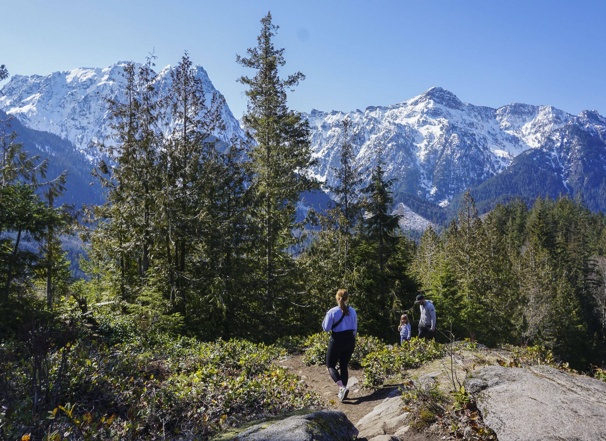 Hikers make their way along the Heybrook Ridge Trail on Friday, March 18, 2023, in Index, Washington. (Kayla Dunn / The Herald).