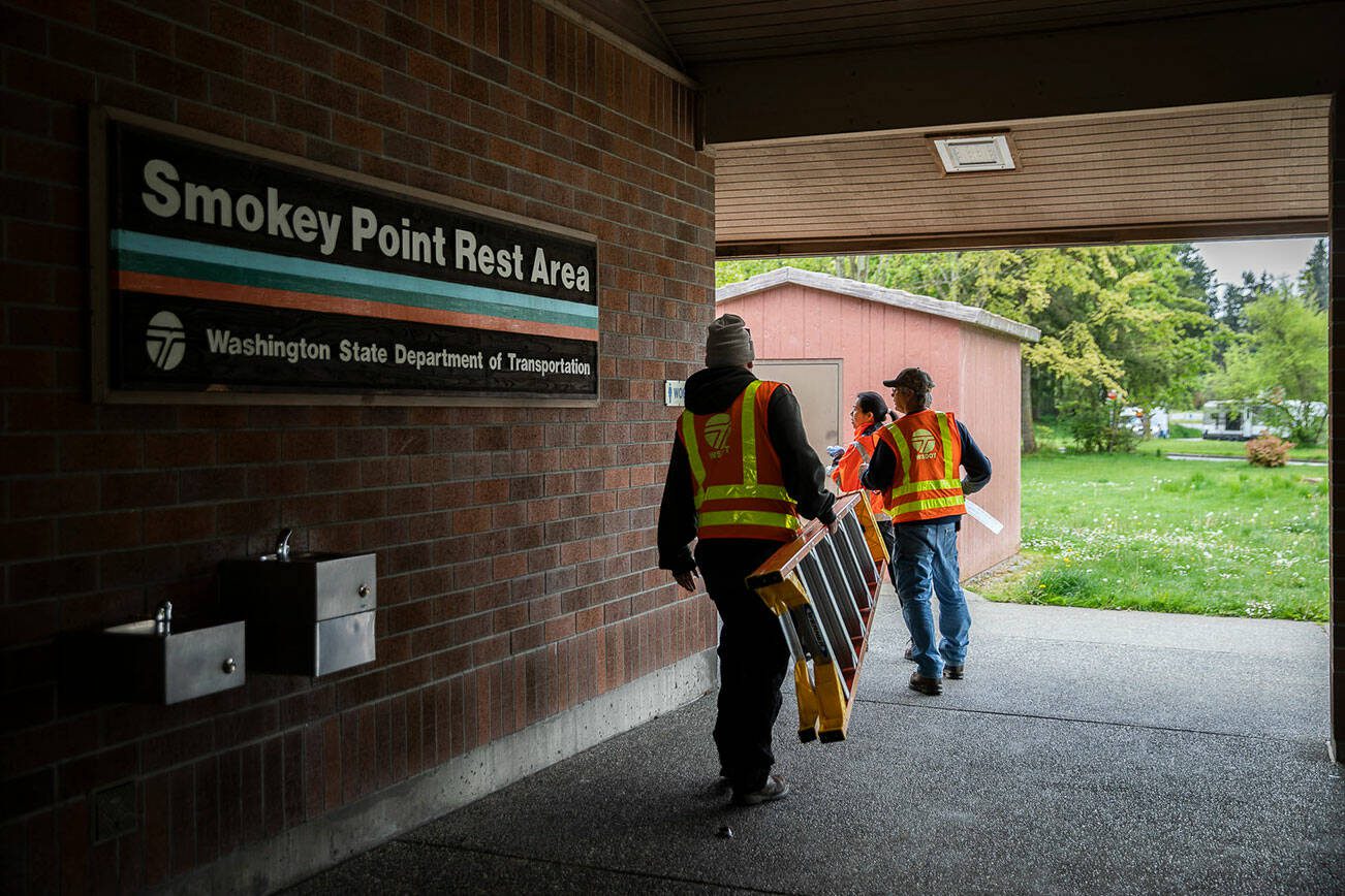 WSDOT workers open up the Smokey Point Rest Area on Tuesday, May 17, 2022 in Arlington, Washington. (Olivia Vanni / The Herald)