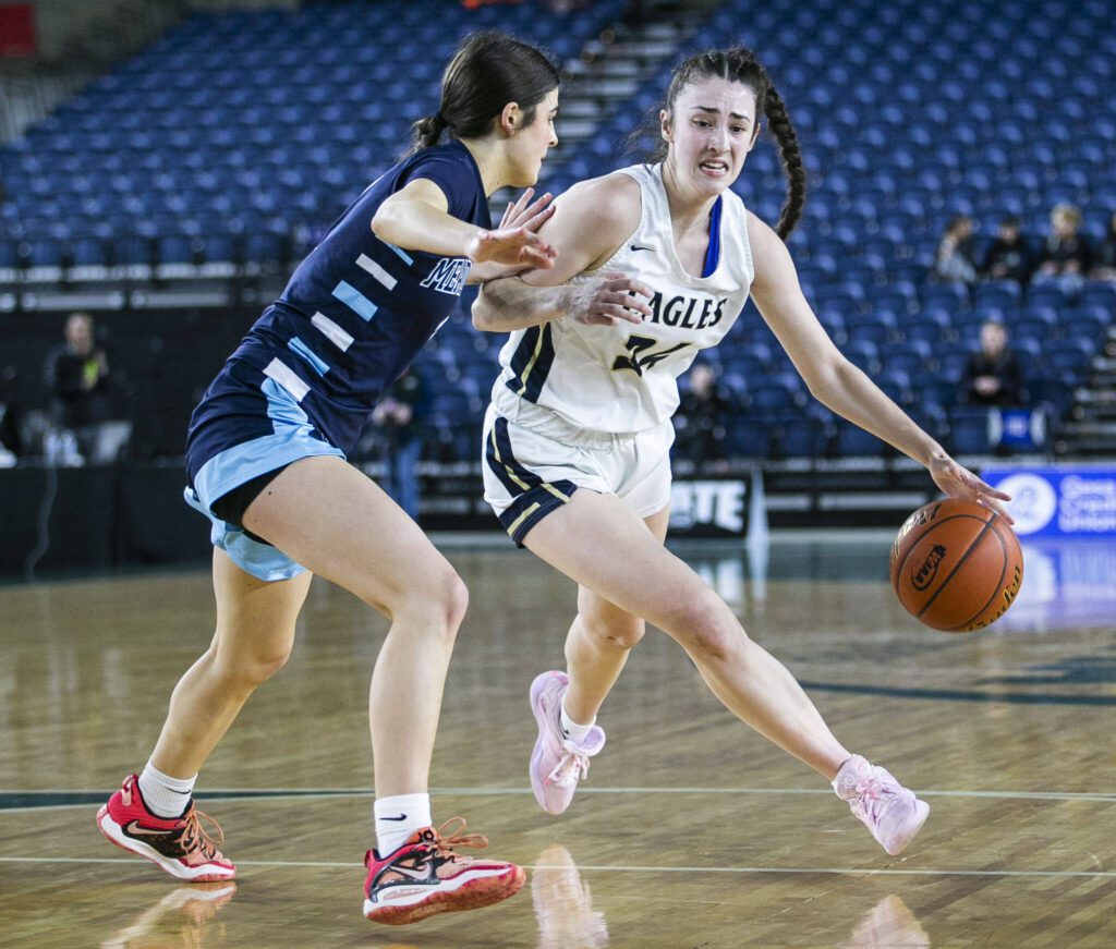 Arlington’s Jenna Villa drives to the hoop during the 3A quarterfinal game against Meadowdale on March 2 in Tacoma. (Olivia Vanni / The Herald)
