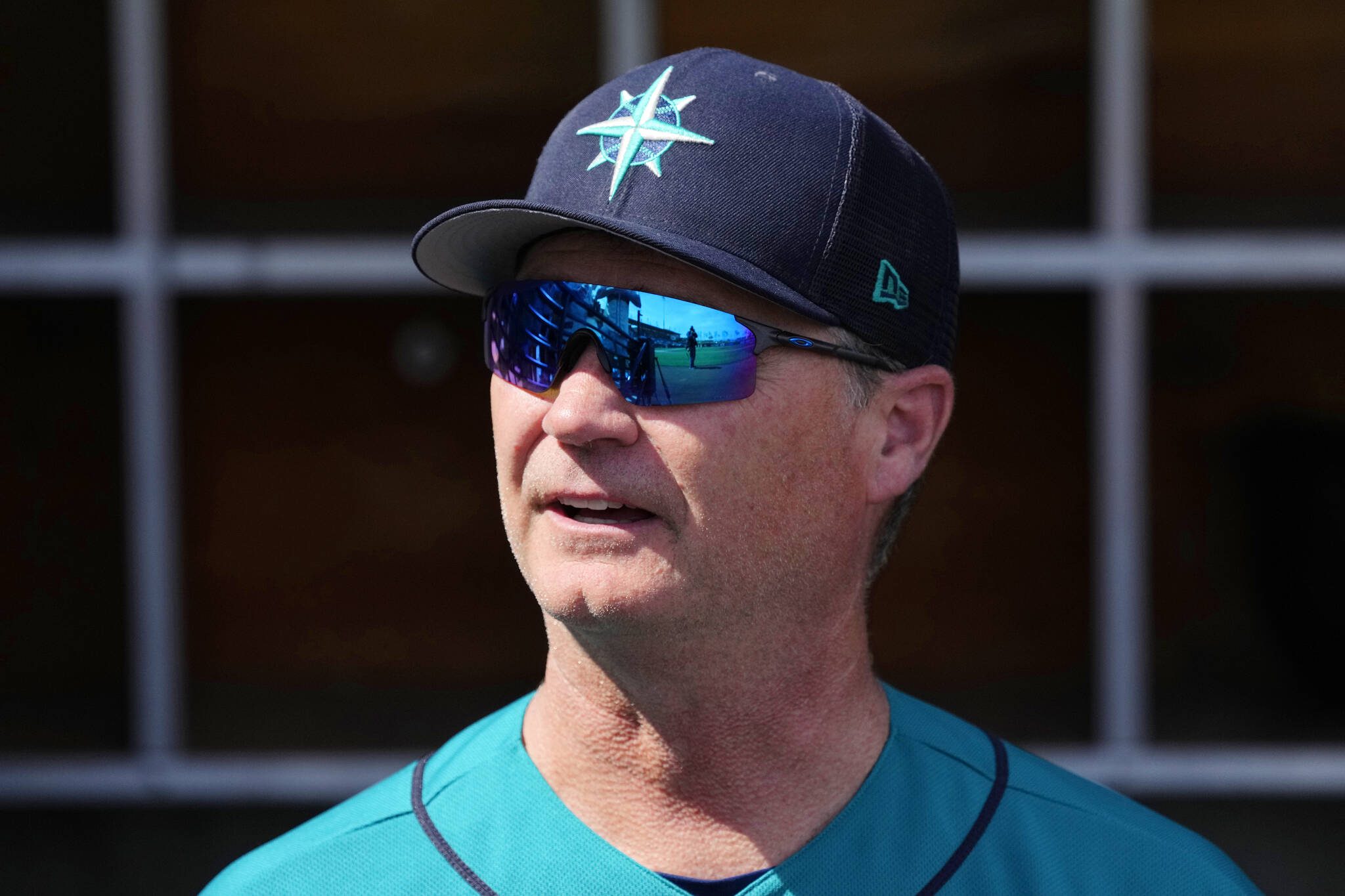 Mariners manager Scott Servais watches from the dugout prior to a spring training game against the Brewers on March 5 in Phoenix. (AP Photo/Ross D. Franklin)