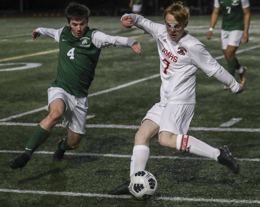 Archbishop Murphy’s Sean Balen (7) kicks the ball during a boys soccer match between Archbishop Murphy and Edmonds-Woodway at Edmonds-Wooday High School in Edmonds, Washington on Tuesday, March 28, 2023. Edmonds-Woodway won, 4-1. (Annie Barker / The Herald)
