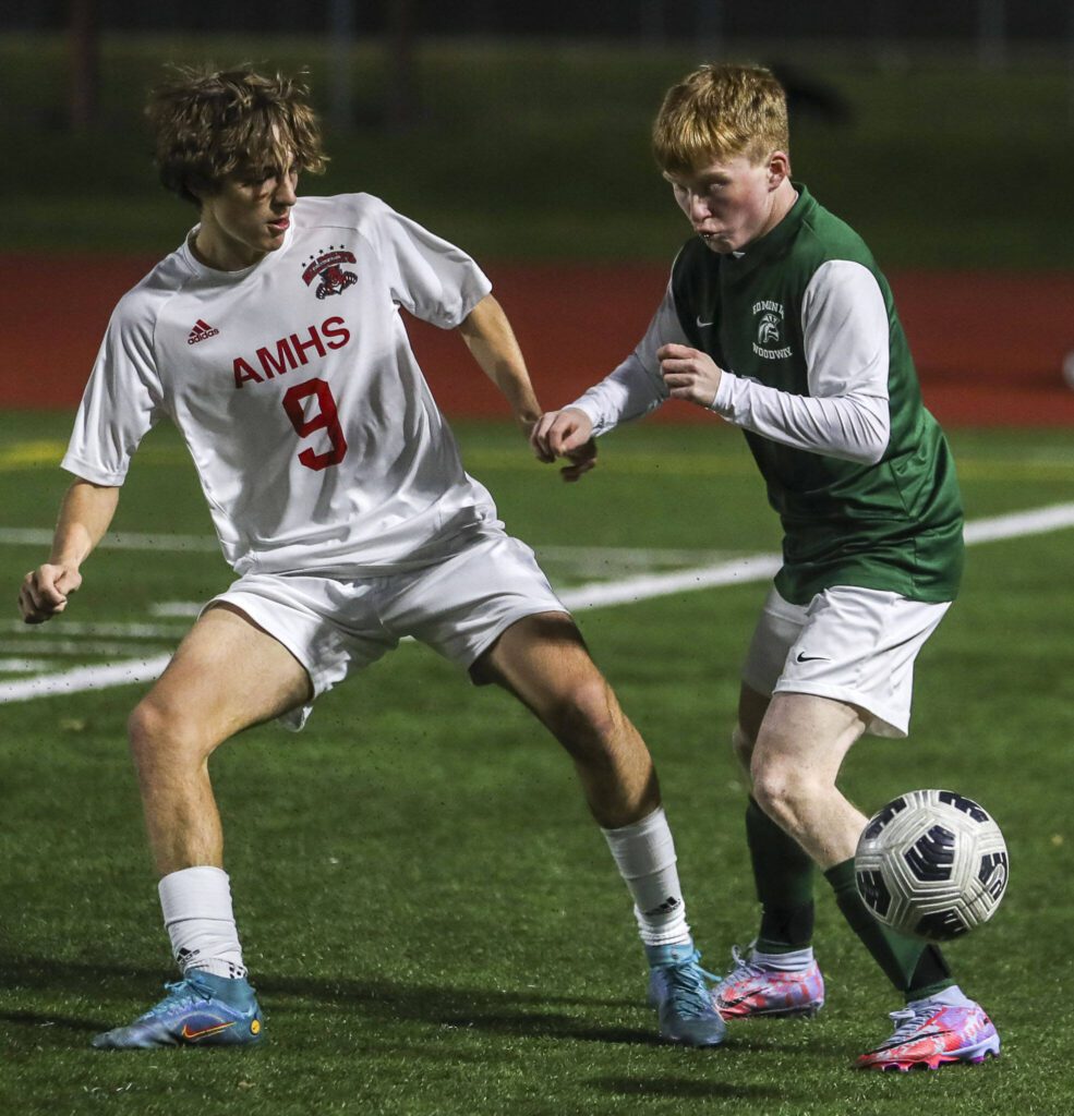 Edmonds-Wooday’s Ben Hanson (10) and Archbishop Murphy’s Zach Mohr (9) fight for the ball during a boys soccer match between Archbishop Murphy and Edmonds-Woodway at Edmonds-Wooday High School in Edmonds, Washington on Tuesday, March 28, 2023. Edmonds-Woodway won, 4-1. (Annie Barker / The Herald)
