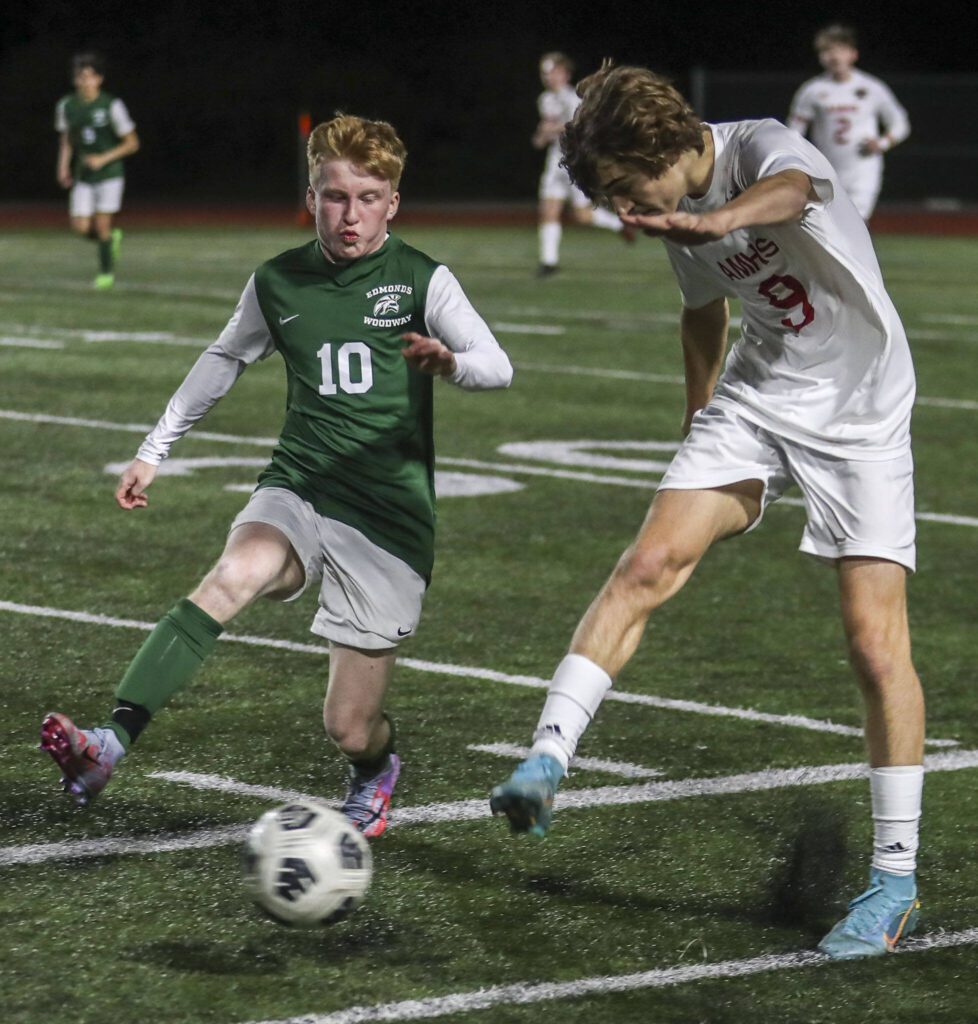 Edmonds-Wooday’s Ben Hanson (10) and Archbishop Murphy’s Zach Mohr (9) fight for the ball during a boys soccer match between Archbishop Murphy and Edmonds-Woodway at Edmonds-Wooday High School in Edmonds, Washington on Tuesday, March 28, 2023. Edmonds-Woodway won, 4-1. (Annie Barker / The Herald)
