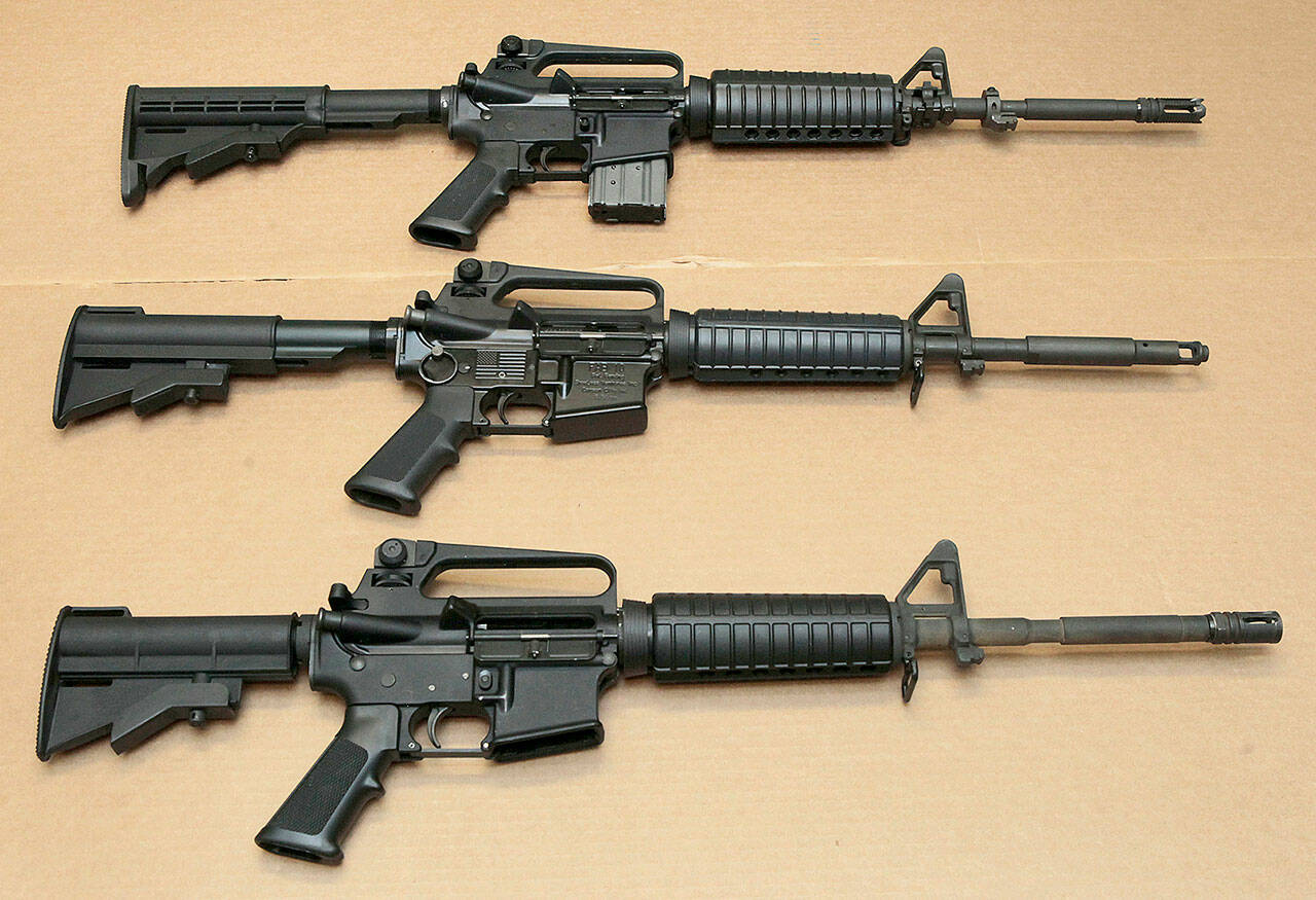 Three variations of the AR-15 assault rifle are displayed at the California Department of Justice in Sacramento, Calif in August 2012. (Rich Pedroncelli / Associated Press file)