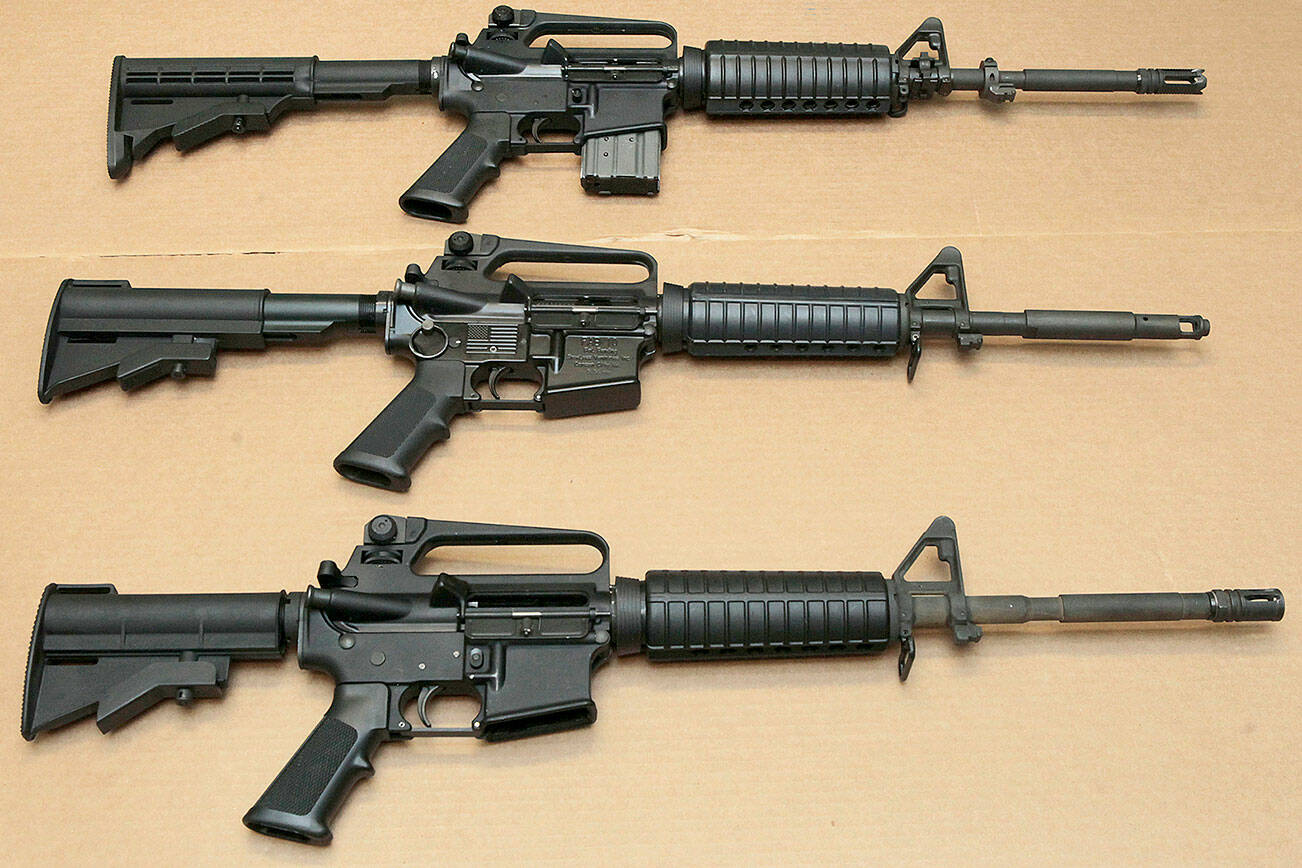 FILE -- In this Aug. 15, 2012 file photo, three variations of the AR-15 assault rifle are displayed at the California Department of Justice in Sacramento, Calif. While the guns look similar, the bottom version is illegal in California because of its quick reload capabilities. Omar Mateen used an AR-15 that he purchased legally when he killed 49 people in an Orlando nightclub over the weekend President Barack Obama and other gun control advocates have repeatedly called for reinstating a federal ban on semi-automatic assault weapons that expired in 2004, but have been thwarted by Republicans in Congress. (AP Photo/Rich Pedroncelli,file)