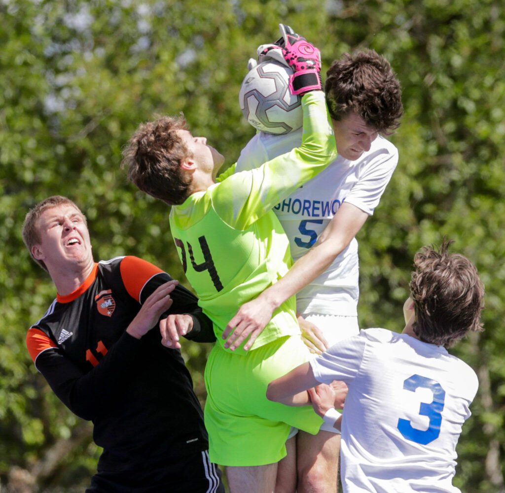 Monroe goalkeeper Dustin Jenkins makes a save against Shorewood on May 14, 2022, at Shoreline Stadium. (Kevin Clark / The Herald)
