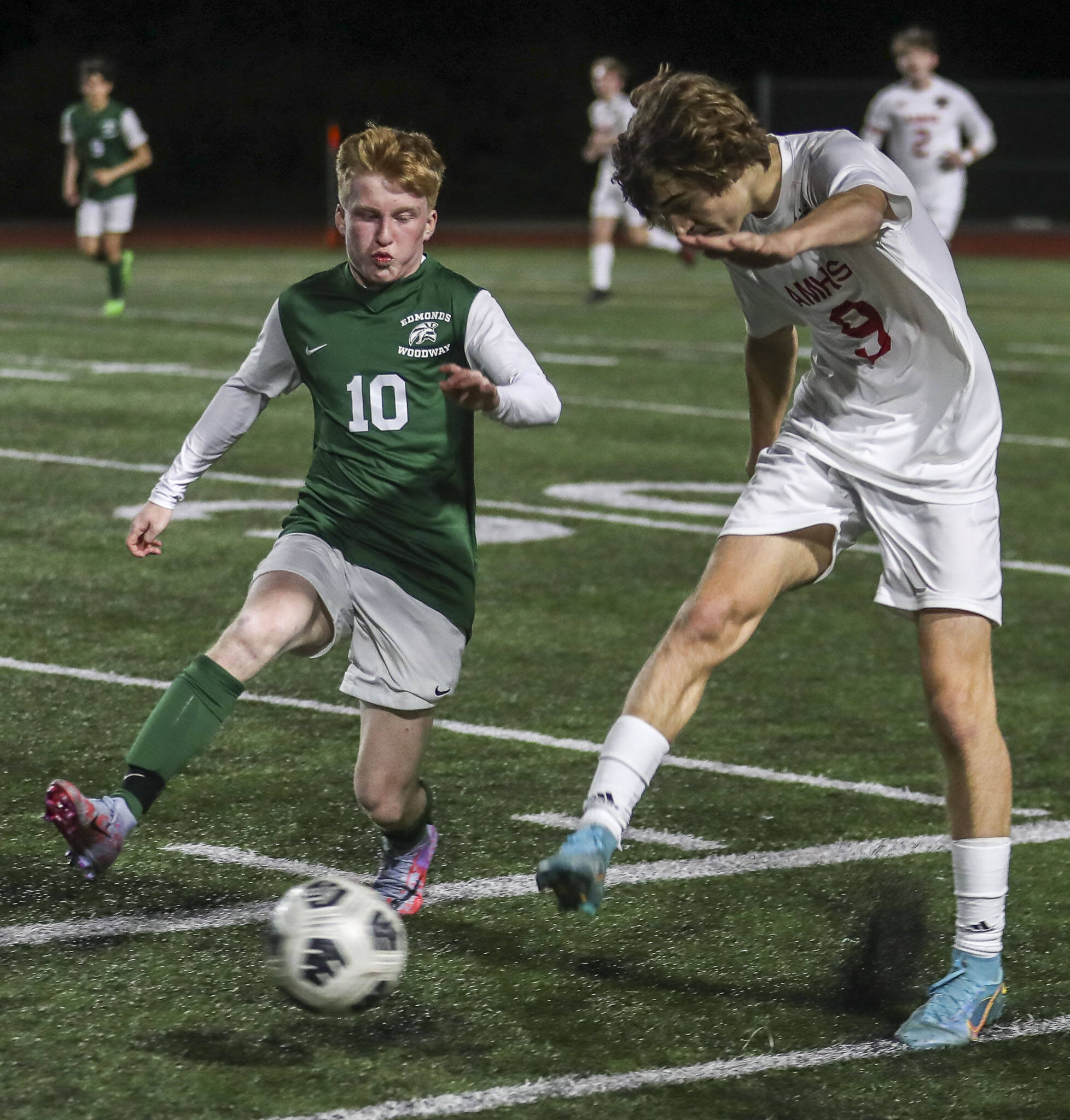 Edmonds-Woodway’s Ben Hanson (10) and Archbishop Murphy’s Zach Mohr (9) fight for the ball during a boys soccer match at Edmonds-Woodway High School. (Annie Barker / The Herald)