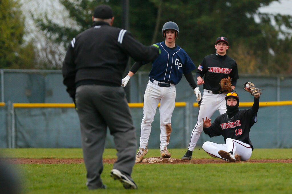 Glacier Peak’s Logan Hall is called out on a close play at second against Snohomish on Friday, March 31, 2023, at Earl Torgeson Field in Snohomish, Washington. (Ryan Berry / The Herald)
