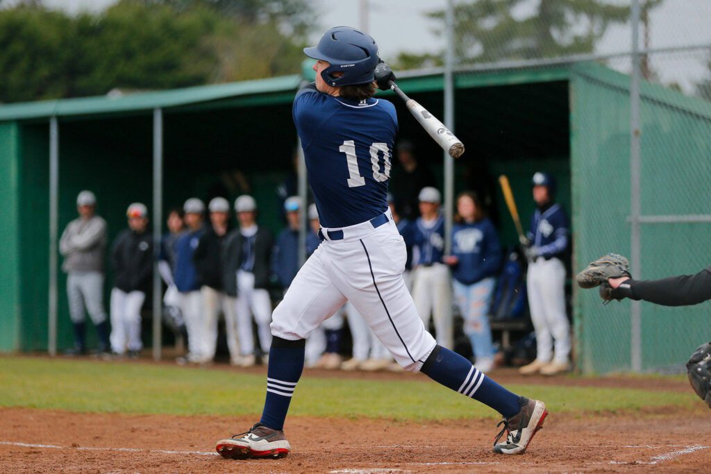 Glacier Peak’s Karsten Sweum knocks the ball in play against Snohomish on Friday, March 31, 2023, at Earl Torgeson Field in Snohomish, Washington. (Ryan Berry / The Herald)
