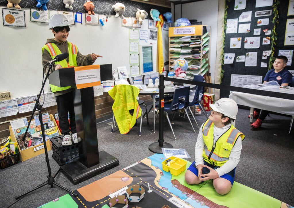 Chenming Guo, left, and Edison Salas present their traffic solution to their class at Hazelwood Elementary School on Wednesday, March 29, 2023, in Lynnwood, Washington. (Olivia Vanni / The Herald)
