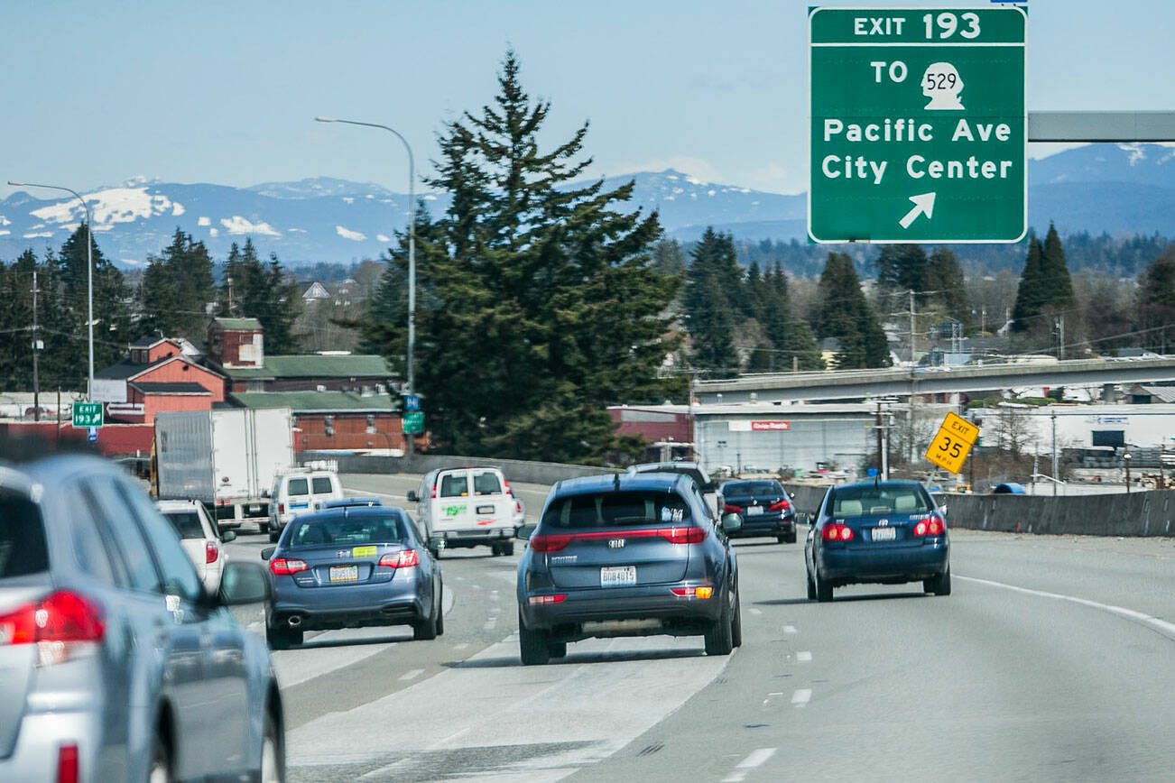 A car merges into the far right lane heading toward the exit to US 2 trestle on Tuesday, March 28, 2023 in Everett, Washington. (Olivia Vanni / The Herald)