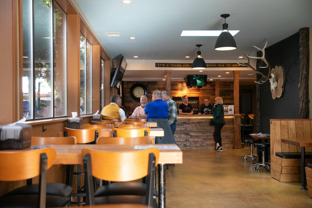 Seating is available in a sunny front room along with other spaces at Three Bull Brewing on Wednesday, April 19, 2023, in Snohomish, Washington. (Ryan Berry / The Herald)
