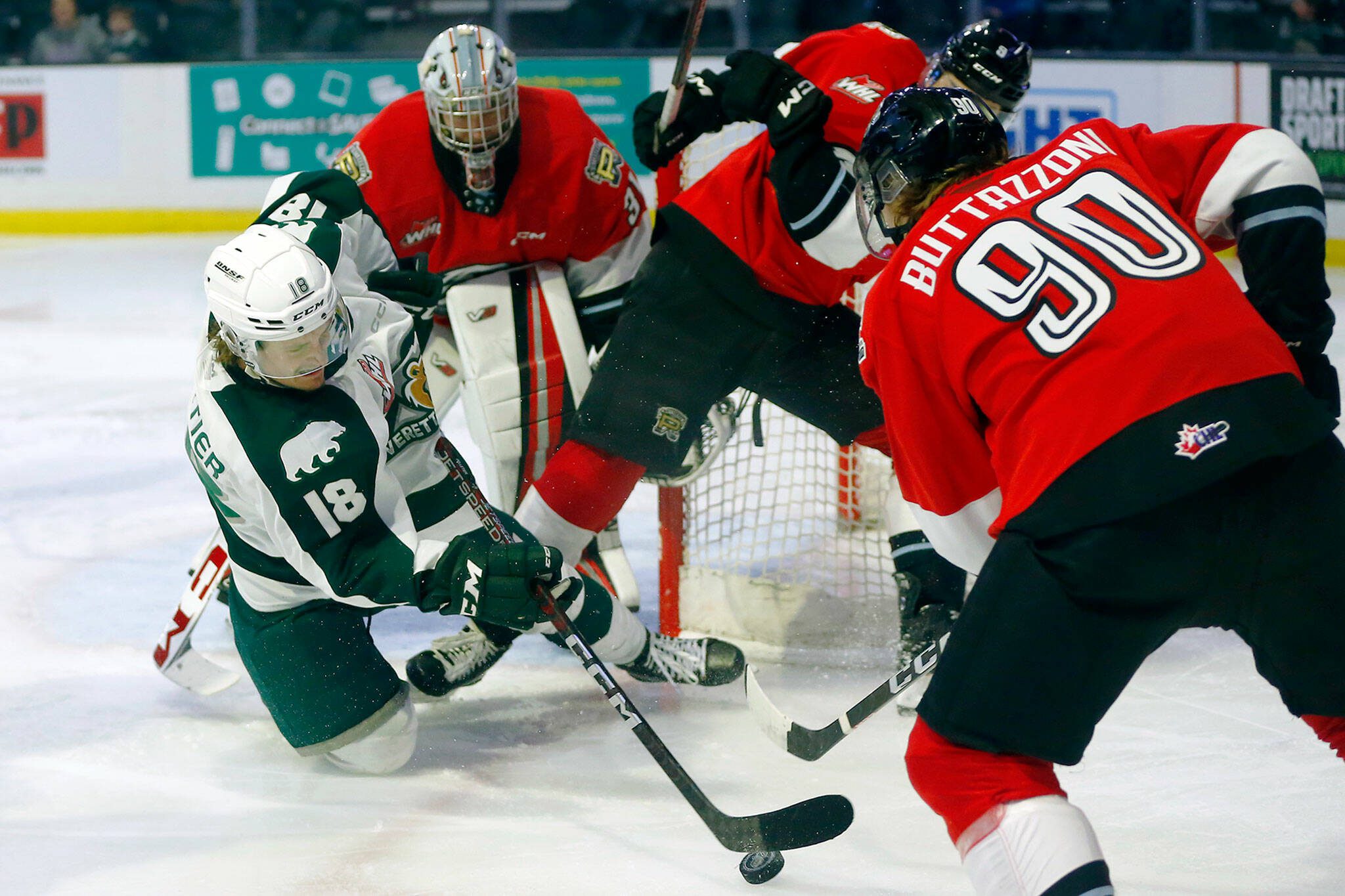 Everett Silvertips center Raphael Pelletier hits the ice while trying to force in a goal during Game 3 of a WHL playoff series against the Portland Winterhawks on Monday at Angel of the Winds Arena in Everett. (Ryan Berry / The Herald)