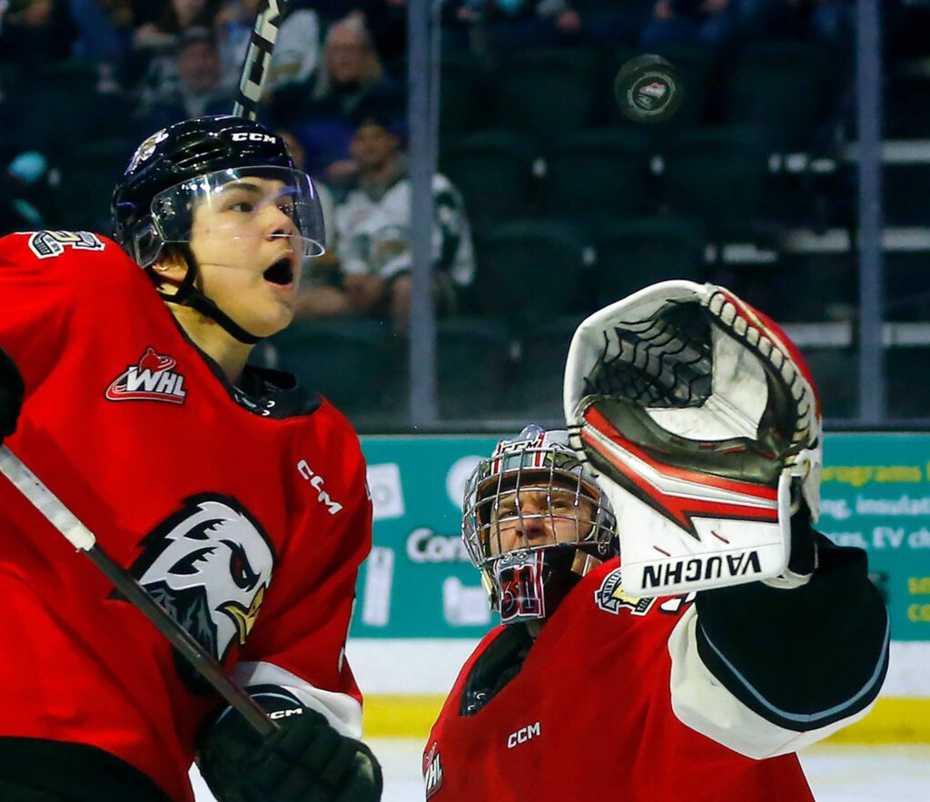 Portland Winterhawks winger Aidan Litke and goaltender Jan Spunar watch the puck sail over the crease against the Everett Silvertips during Game 3 of a first-round WHL playoff series on Monday at Angel of the Winds Arena in Everett. (Ryan Berry / The Herald)
