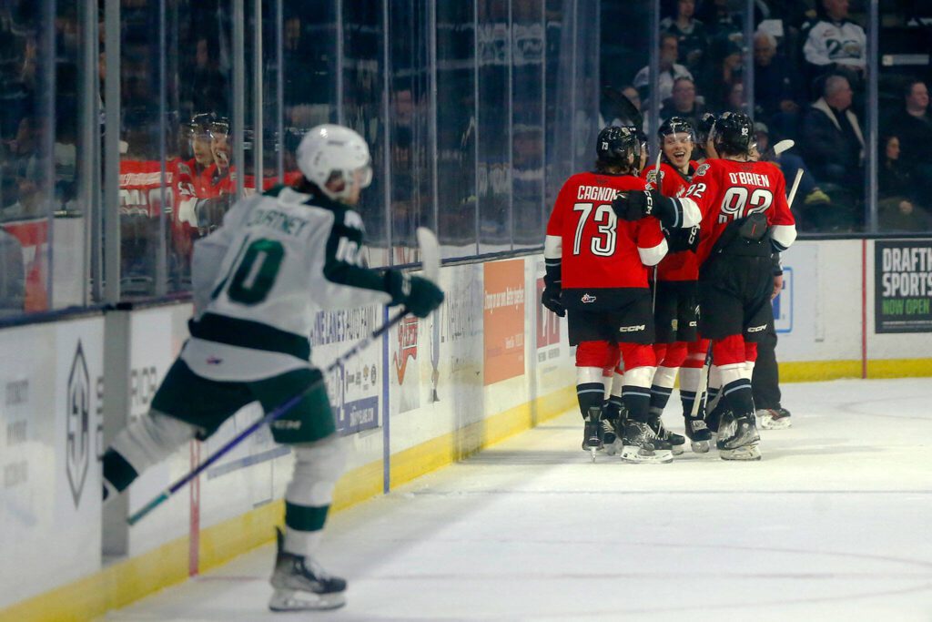 Everett Silvertips center Beau Courtney heads out of the penalty box as the Winterhawks celebrate one of multiple second period goals during Game 3 of a first-round WHL playoff series on Monday at Angel of the Winds Arena in Everett. (Ryan Berry / The Herald)
