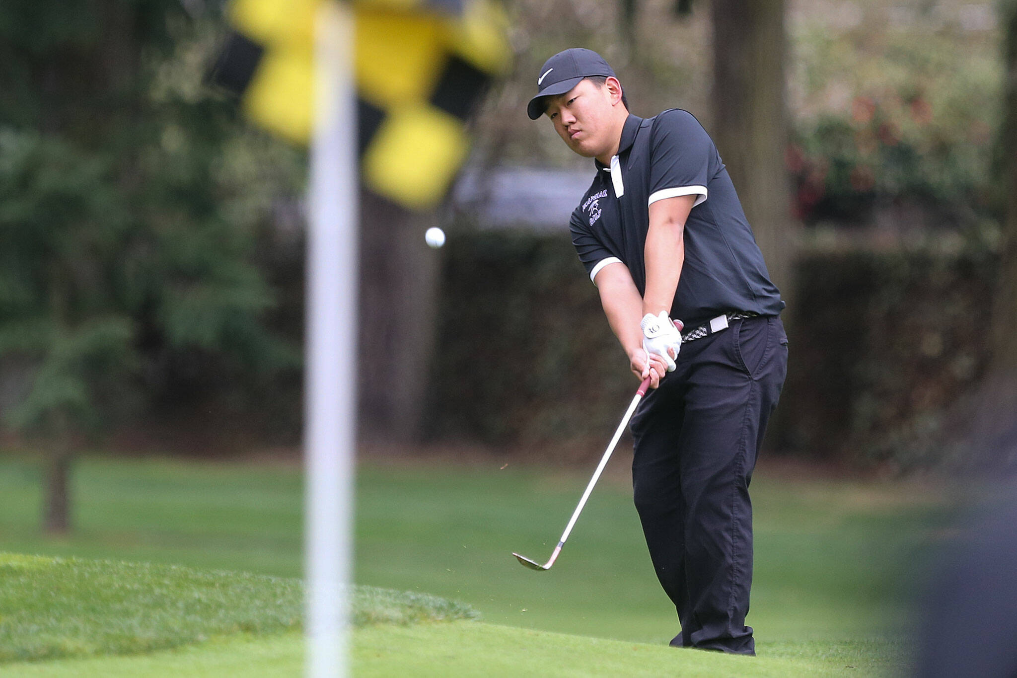 Kamiak's Devin Kim putts during the Tom Dolan Memorial Invitational golf tournament Monday afternoon at Everett Golf & County Club in Everett on April 8, 2019. (Kevin Clark / The Herald)