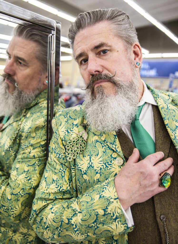 Tim Lambright inside Value Village wearing a completely thrifted outfit. (Olivia Vanni / The Herald)
