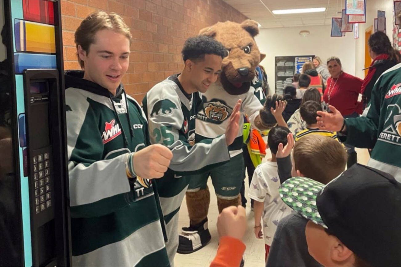 Everett Silvertips' Beau Courtney (left) was named U.S. Division Humanitarian of the Year and a finalist for the WHL's Doug Wickenheiser Memorial Trophy as the WHL's Humanitarian of the Year. (Photo courtesy of Everett Silvertips)