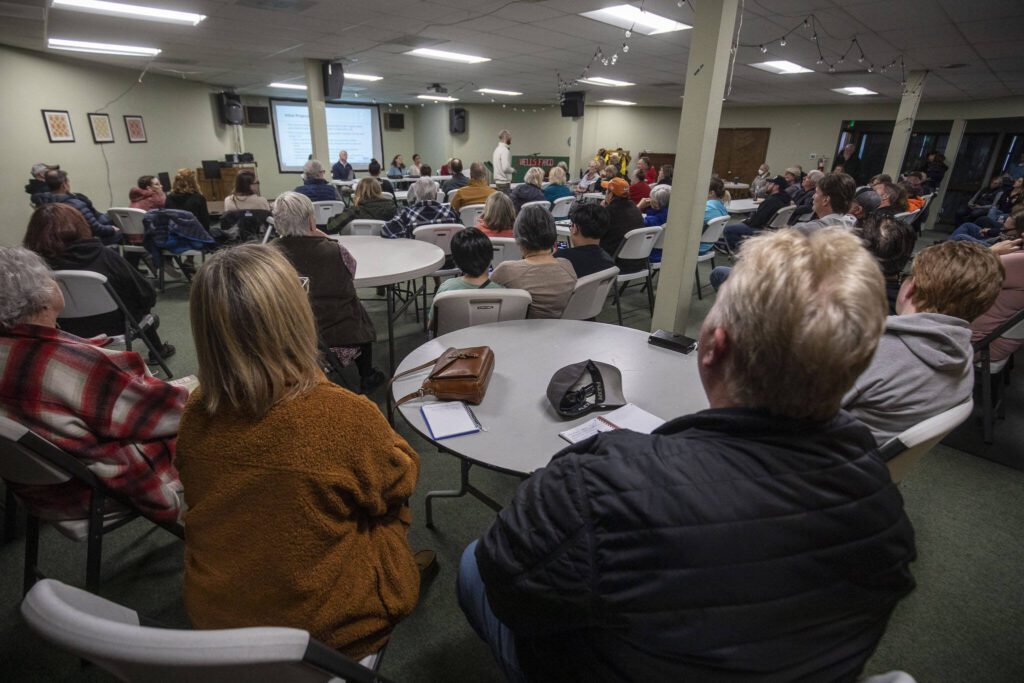 People sit and listen at Hope Church in Everett, Washington on Wednesday, April 5, 2023. The church will potentially be converted to a low barrier homeless shelter. (Annie Barker / The Herald)
