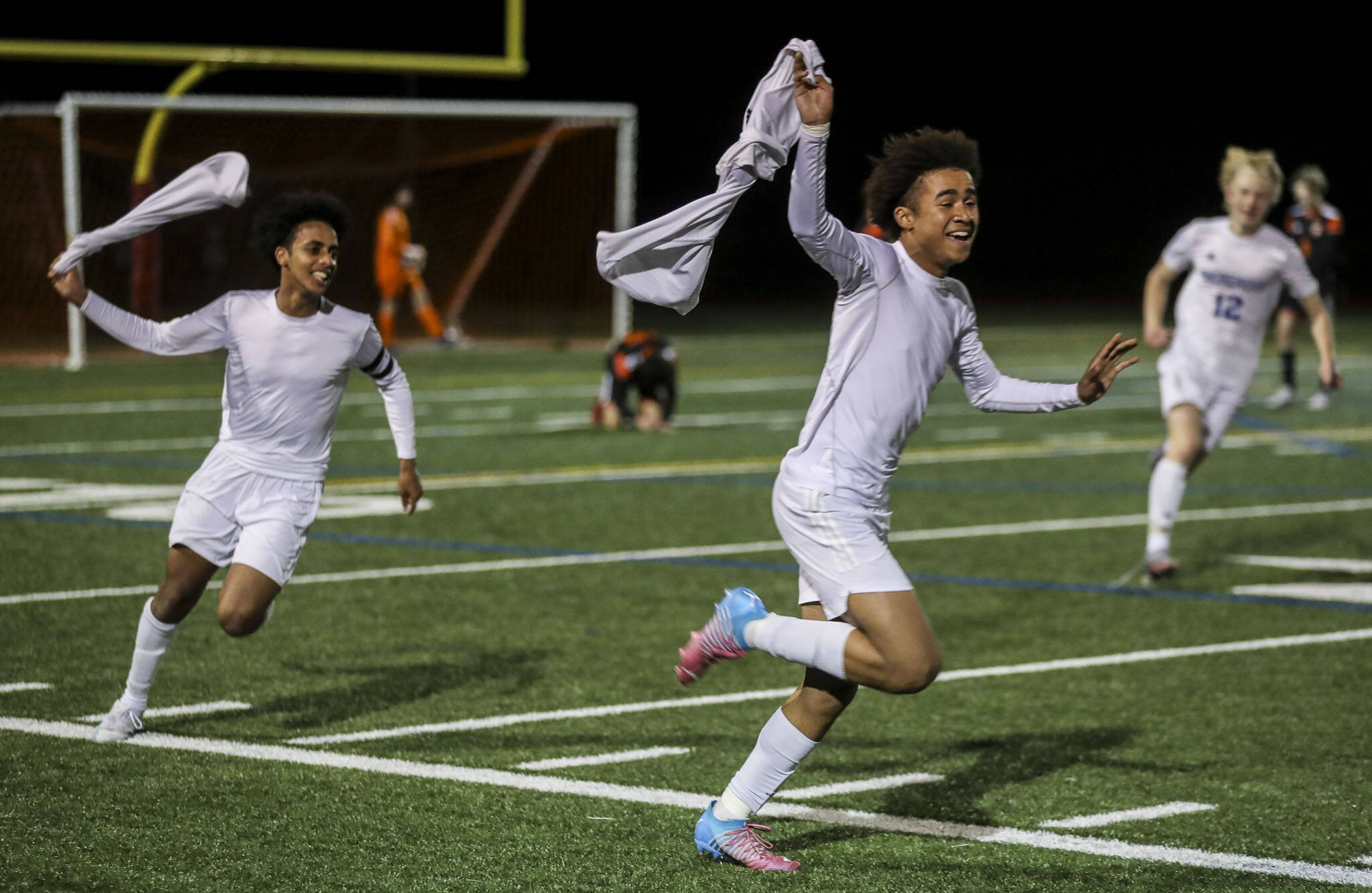 Shorewood players celebrate during a game against Monroe at Monroe High School on Friday. Shorewood won in double overtime, 3-2. (Annie Barker / The Herald)