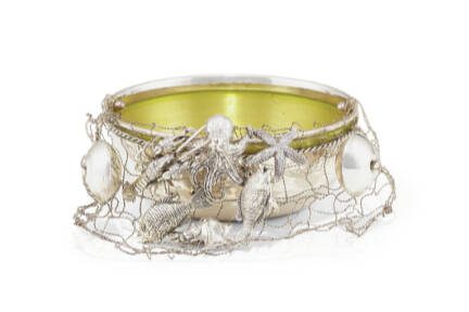 Three-dimensional silver figures of animals and wildlife are often seen on elaborate silver pieces. This bowl takes a slightly different approach, with figures of sea animals attached to a wire net.