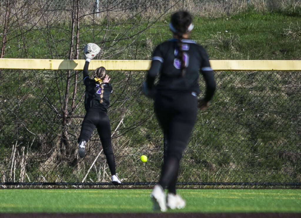 A ball hits off the fence during the game on Tuesday, April 11, 2023 in Everett, Washington. (Olivia Vanni / The Herald)

