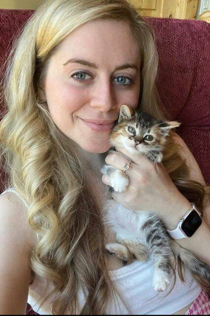 Ashley Morrison pictured with one of her rescue kittens. Although not all were in her home, at one time Ashley had 33 cats under her care. (Photo provided by Cindi Morrison)