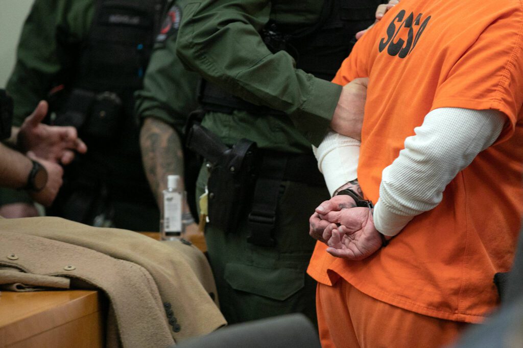 Richard Rotter is cuffed and guided out of the courtroom after being sentenced on Monday, April 17, 2023, at Snohomish County Superior Court in Everett, Washington. (Ryan Berry / The Herald)
