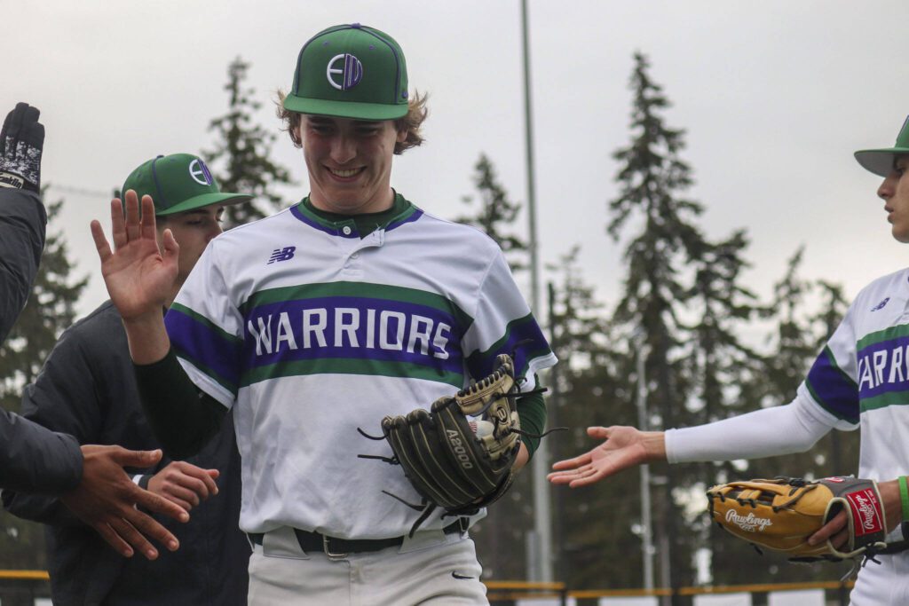 Warrior players celebrate during a baseball game between Edmonds-Woodway and Mountlake Terrace at Edmonds-Woodway High School in Edmonds, Washington on Thursday, April 13, 2023. The Warriors won, 5-1. (Annie Barker / The Herald)
